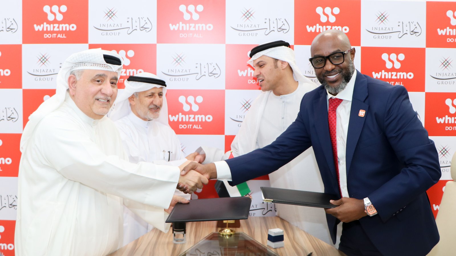 Whizmo and Injazat Group partnership signing